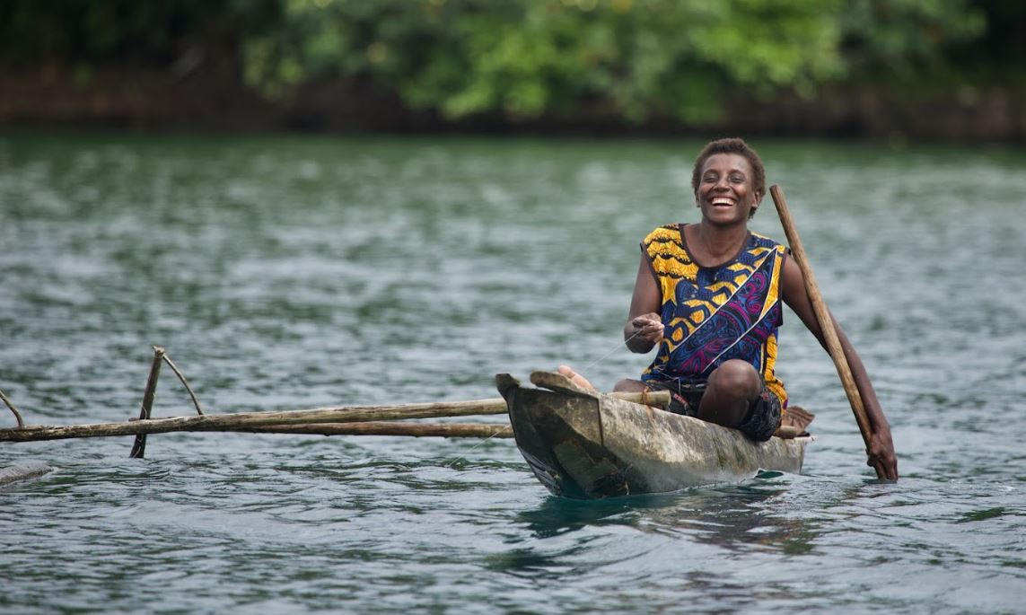 Woman fishing in Papua New Guinea