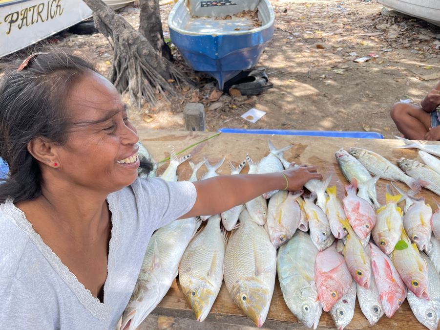 Woman selling fish at the market in Kiribati